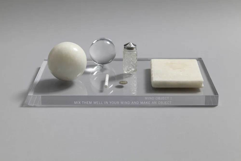 Mind Object I 1960 / 1966, Acrylic, marble, coin, cigarette, salt shaker h.2.5 x w.45.5 x d.30.0 cm ©Yoko Ono
