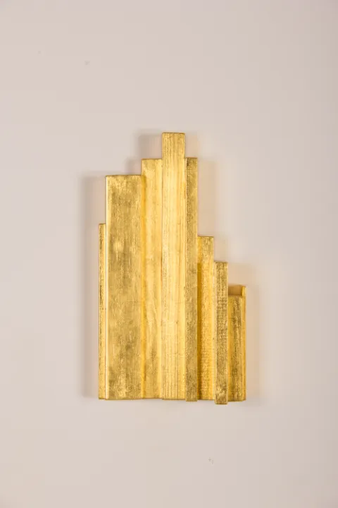 Jonathan Monk, Sol Always Shines (nine books from my library) AP2, 2020 wood, wood glue, water based varnish, 24 carat gold leaf and plastic wall fixtures 21 x 12 x 6 cm